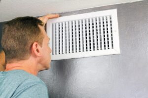 AC blowing warm air through vent